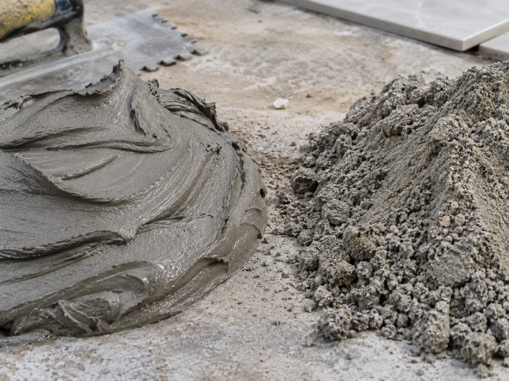Close-up comparison of tile adhesive and cement mortar texture